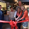 Pacific Coast Cafe cutting ribbon
