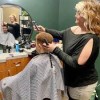 Sola Salon Studios Rapid City-child having hair cut