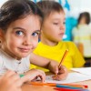 Little Girl Writing while Smiling in Kentucky, Fort Campbell