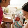 Mom with infant and staff in Yokosuka, Japan