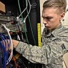 Base Operator- Ellsworth AFB- servicemen fxing the phone cables Base Operator- Ellsworth AFB- servicemen fxing the phone cables